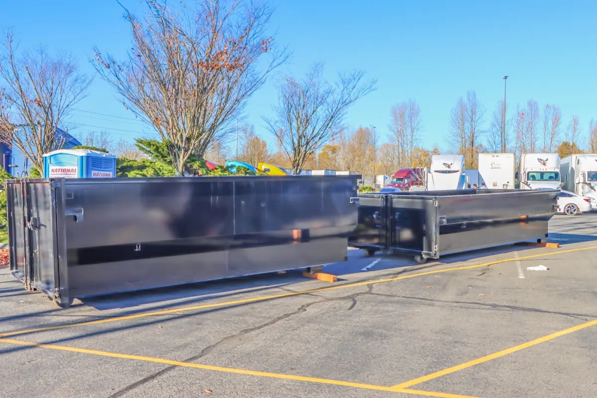 Professional dumpster rental service with roll-off container on residential driveway in Mount Juliet